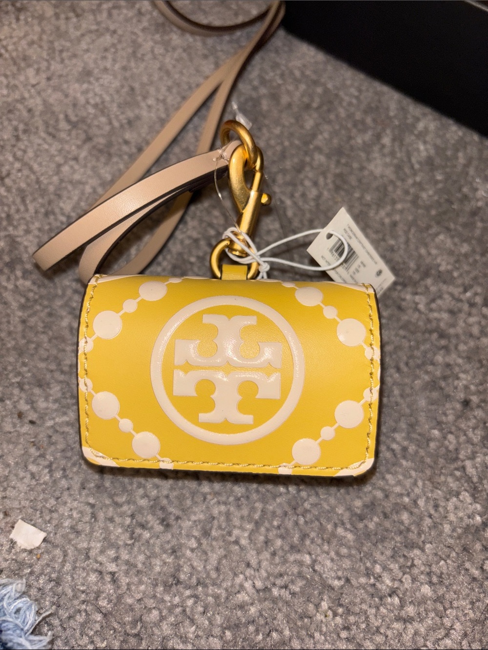 Tory Burch Yellow Leather Air Pod case.